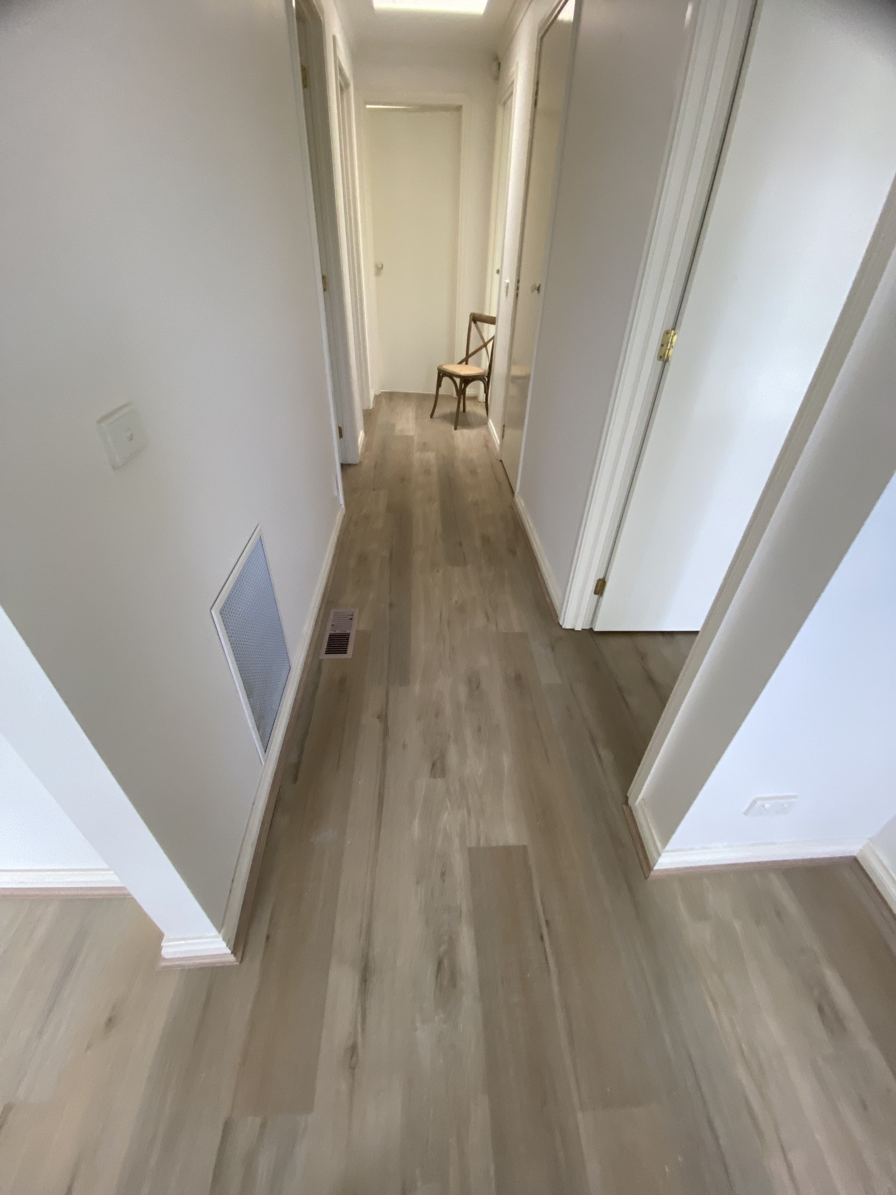 Light natural oak hybrid plank flooring hallway Melbourne home