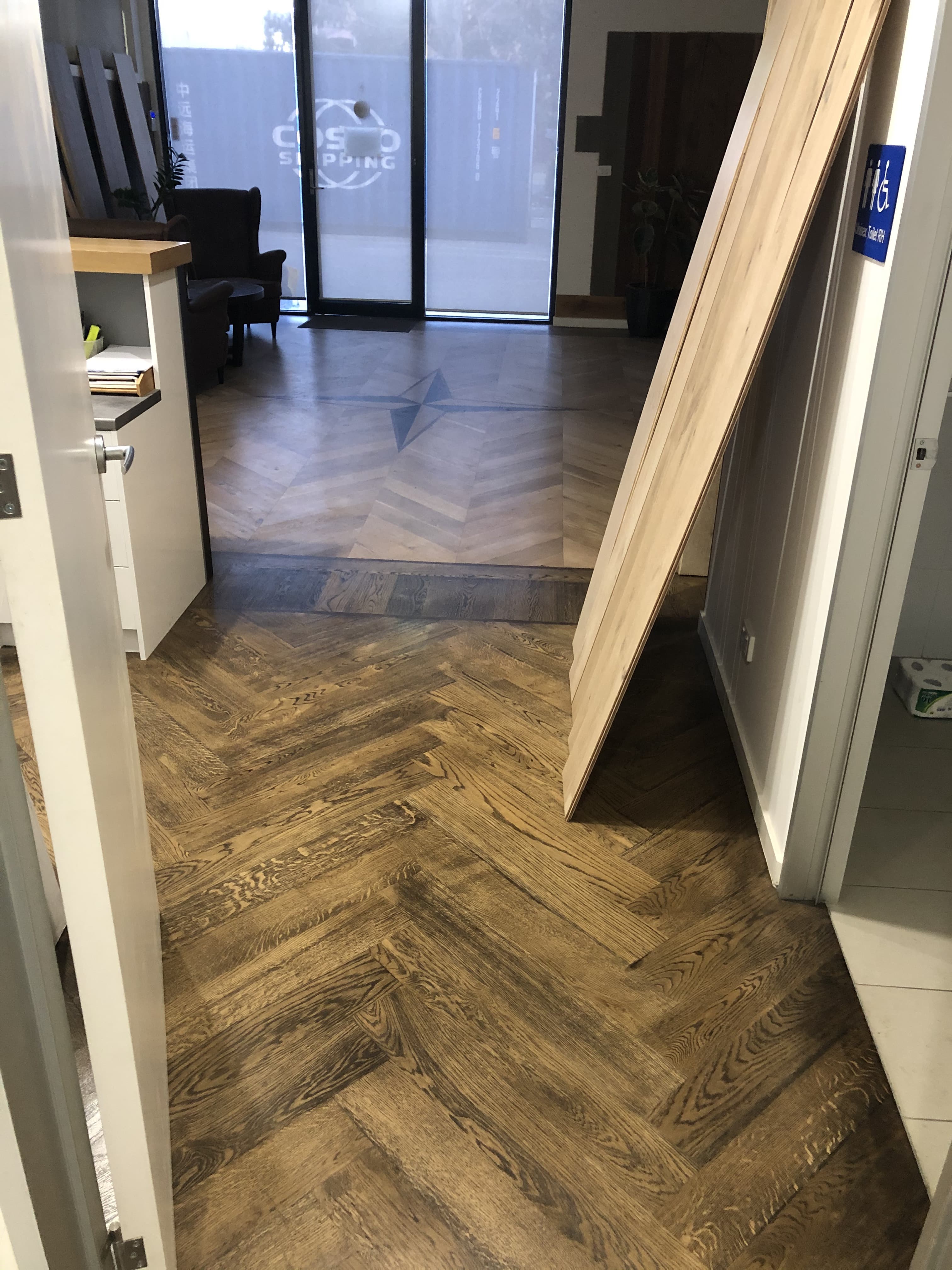 Smoked walnut herringbone hybrid flooring retail space Melbourne