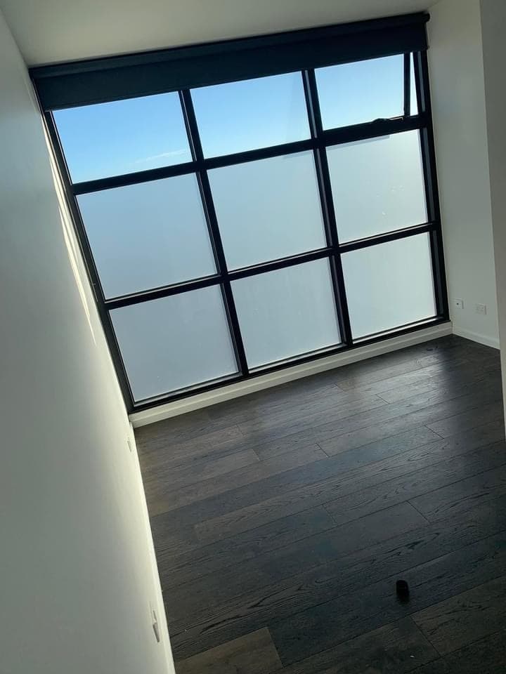 Premium hybrid flooring Melbourne apartment skyline view