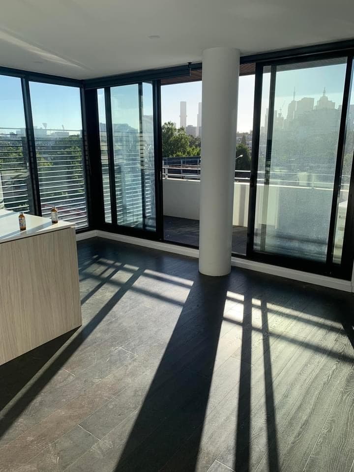 Dark timber hybrid flooring high-rise apartment Melbourne